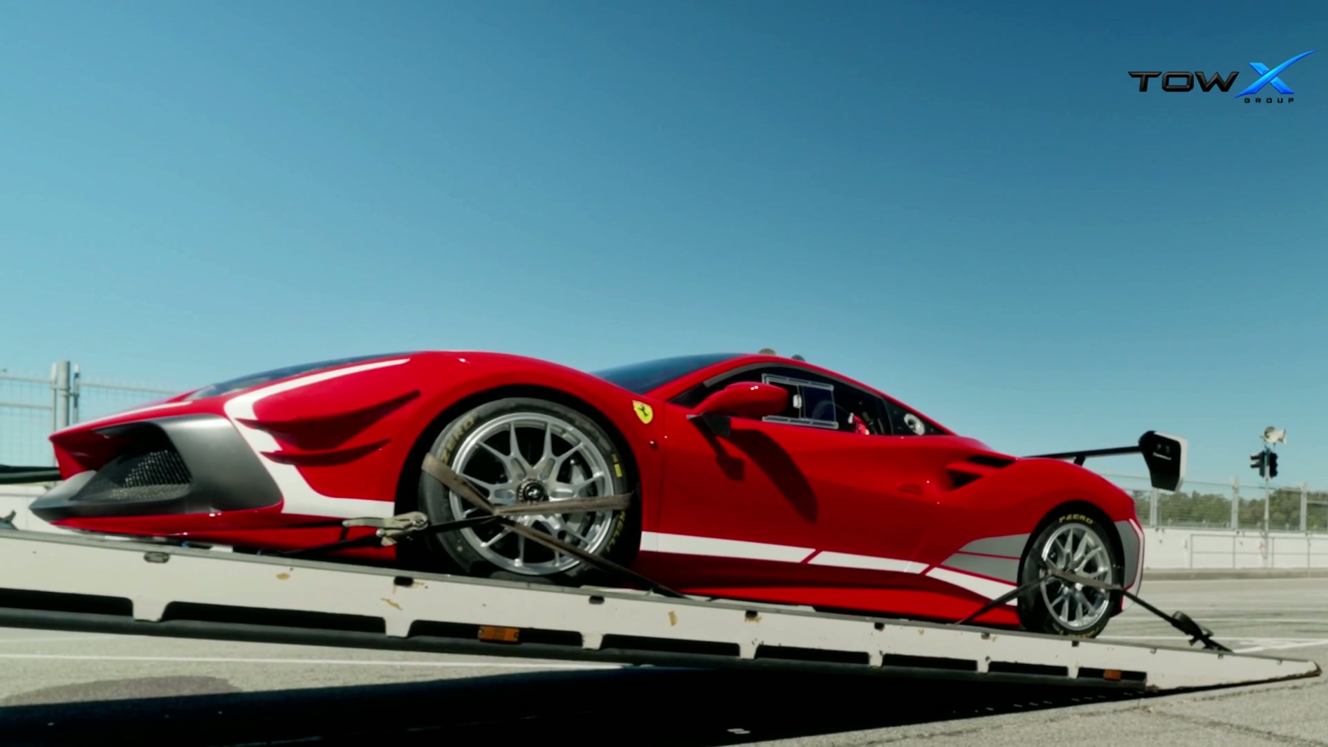 Ferrari on a vehicle transporter, captured from the supplied TowX video
