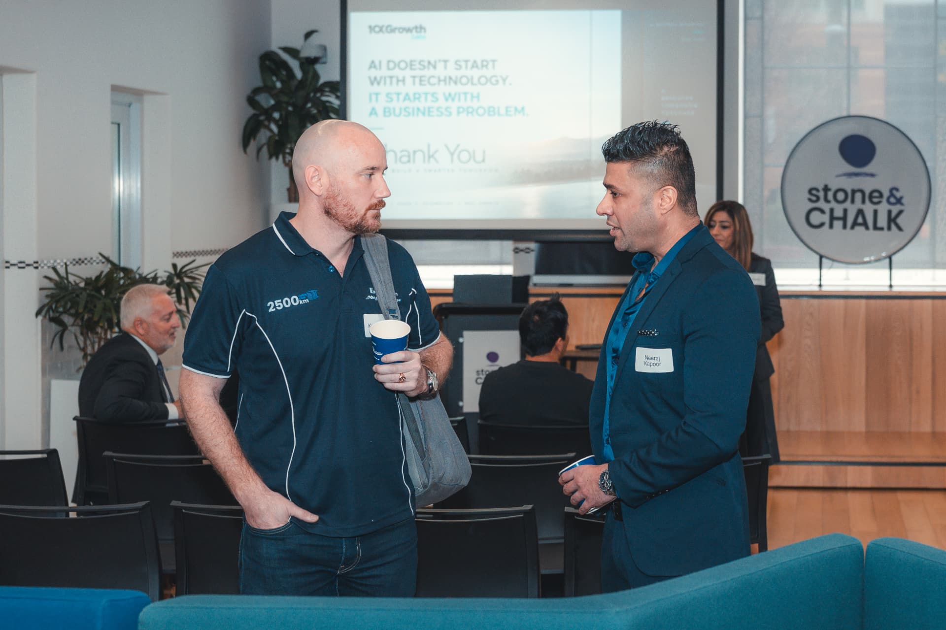 10xGrowth Labs team in conversation at a business event