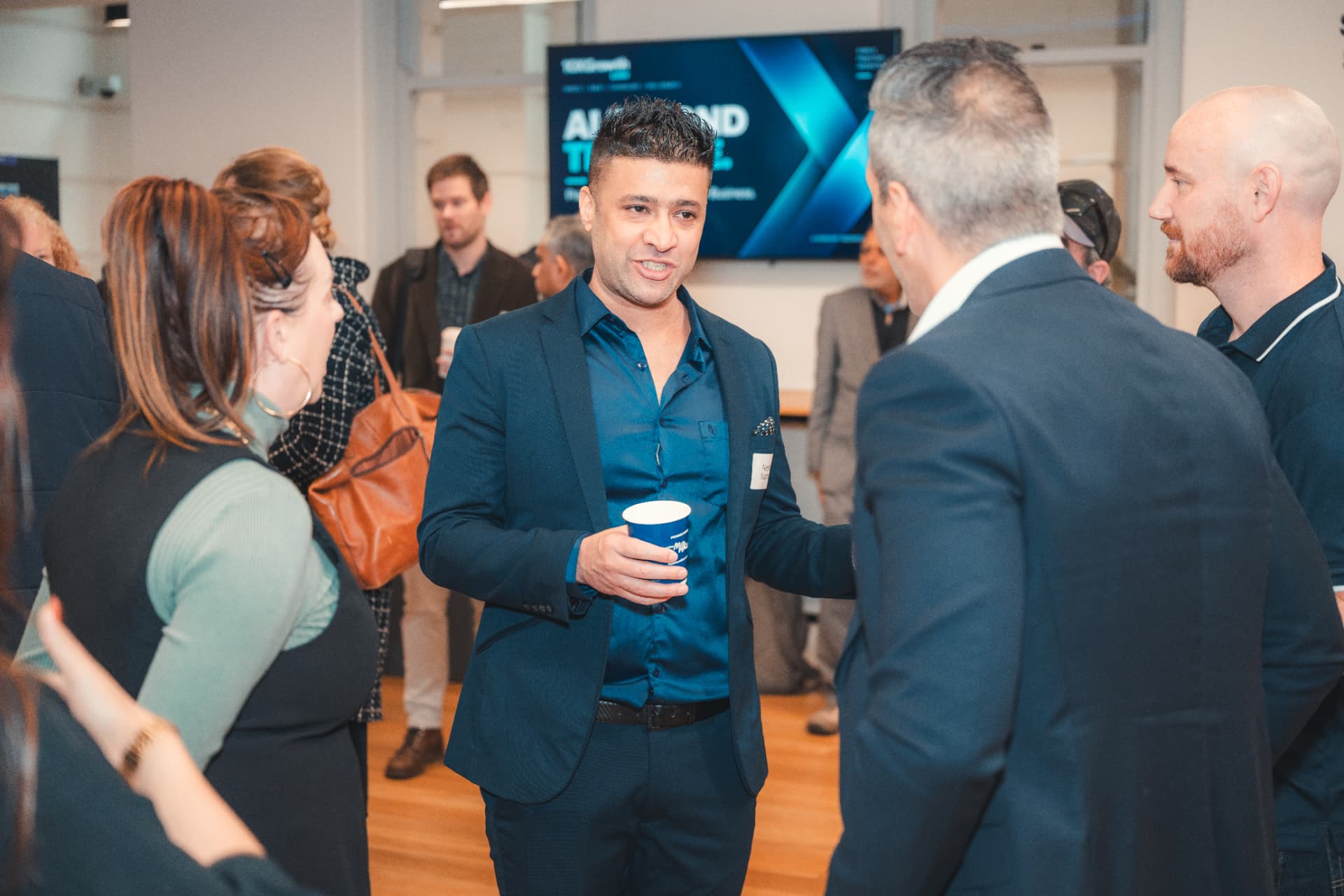 Guests networking during a break at a 10xGrowth Labs AI event