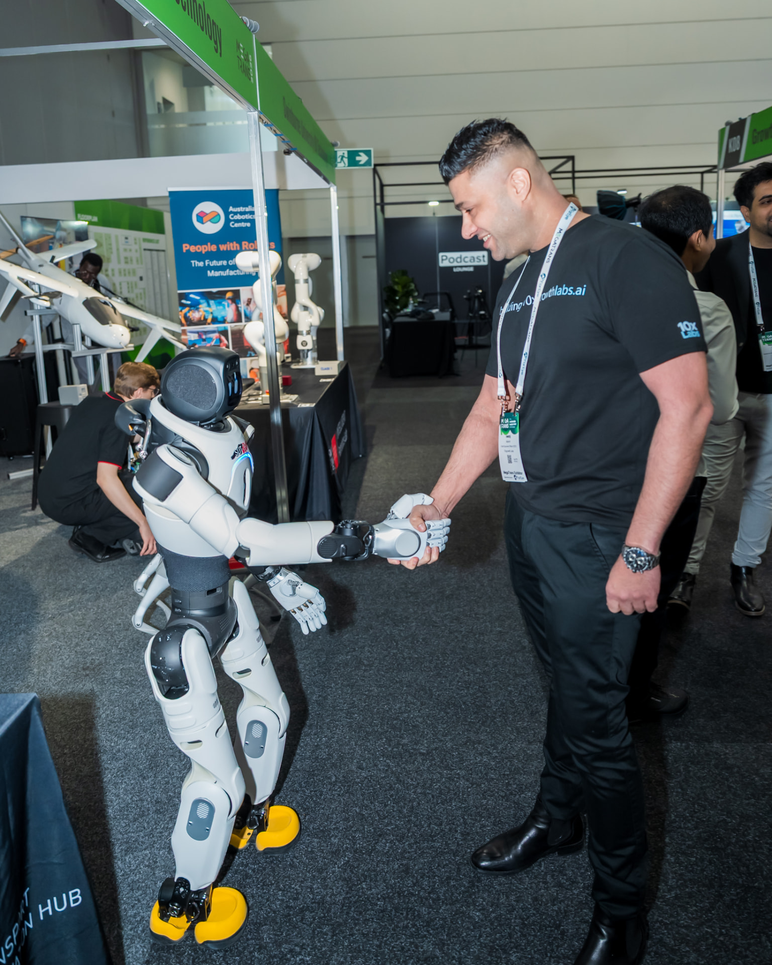 Visitor meeting a demonstration robot at MEGATRANS 2026